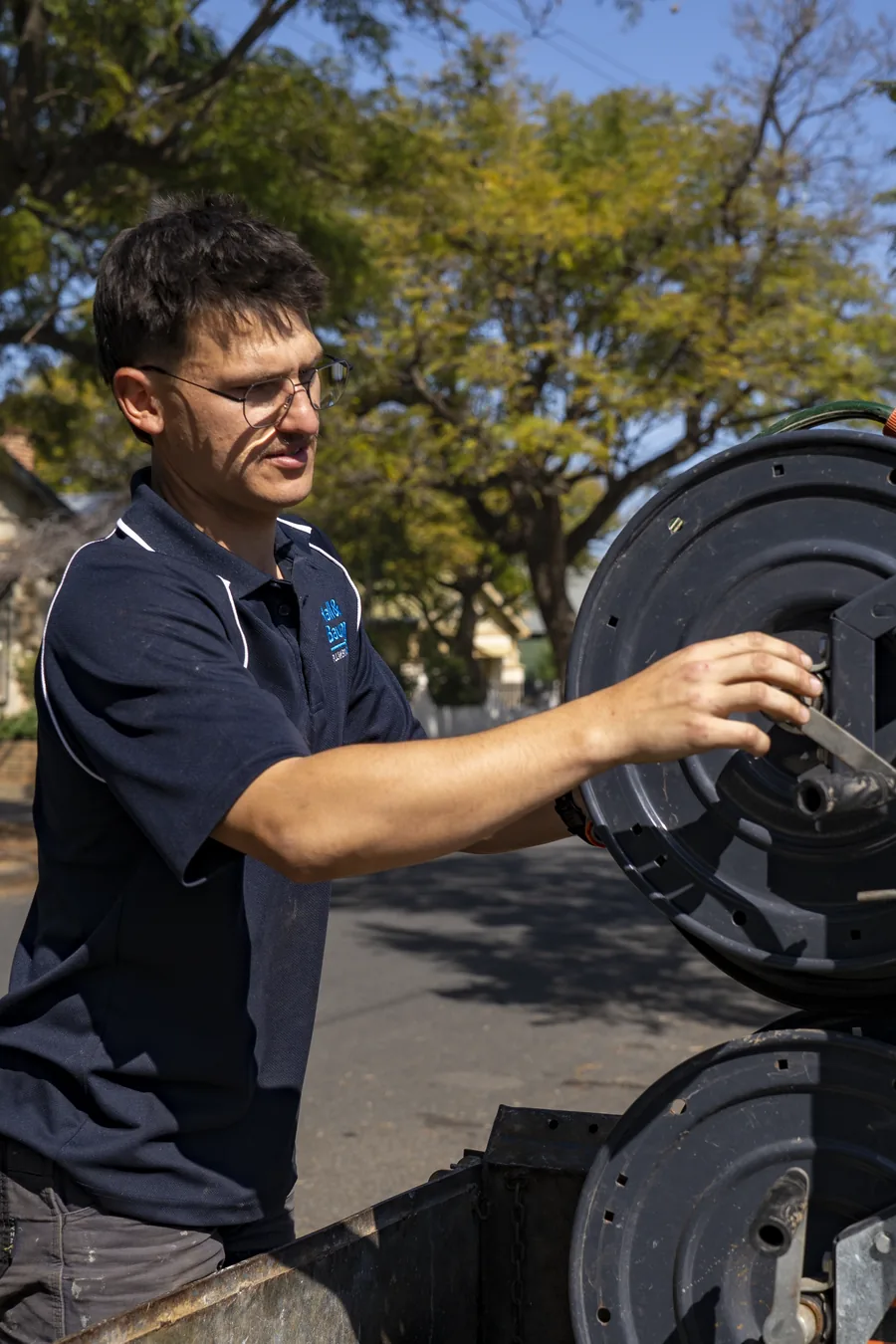 Hall & Baum plumber operating drain cleaning equipment