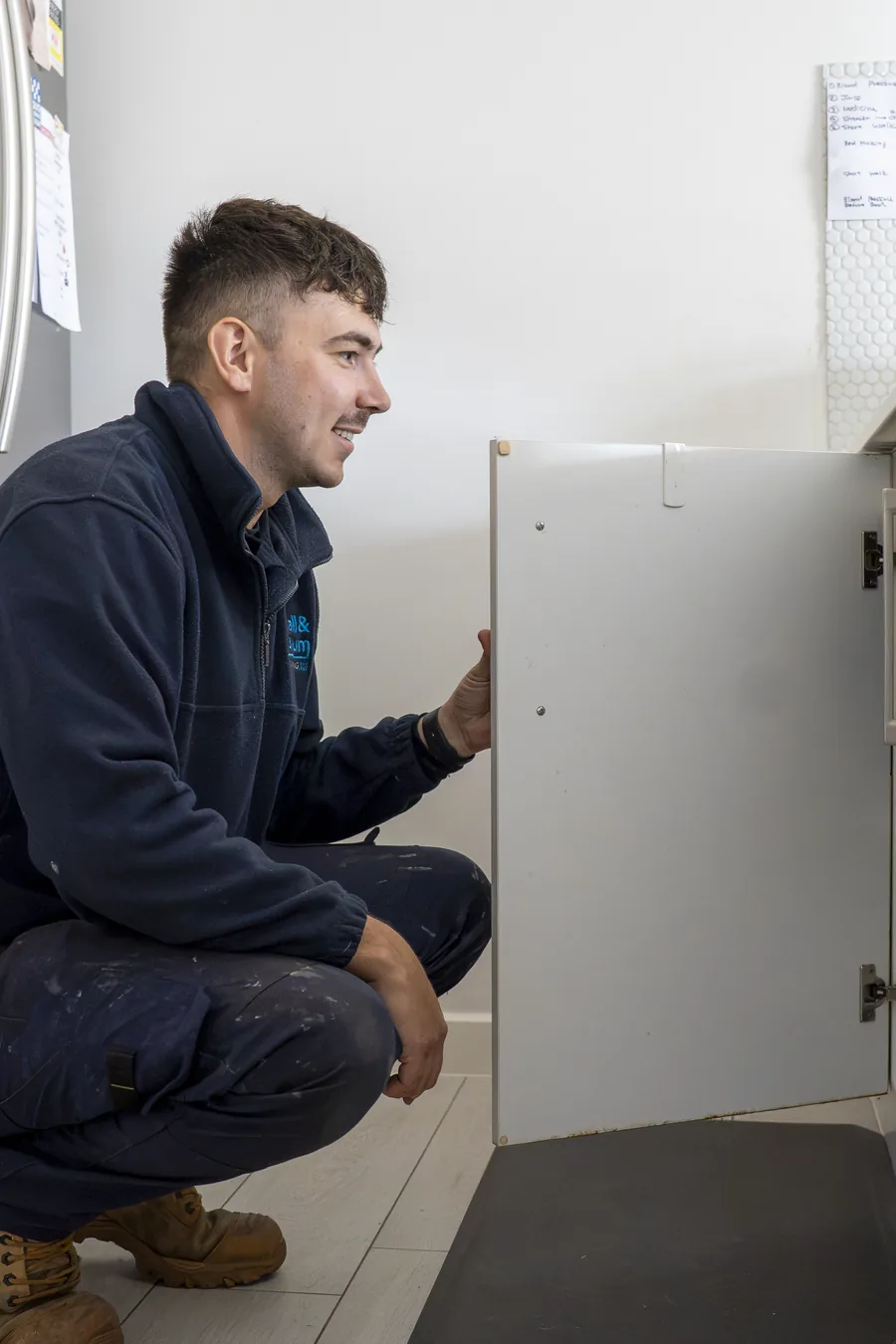 Hall & Baum plumber working on internal plumbing