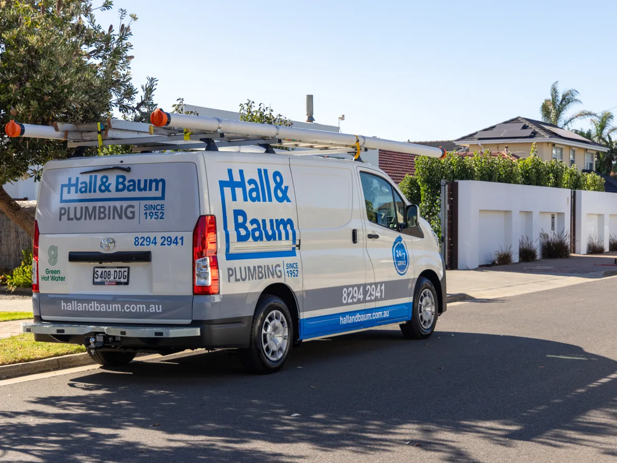 Hall & Baum plumbing service van parked outside an Adelaide home