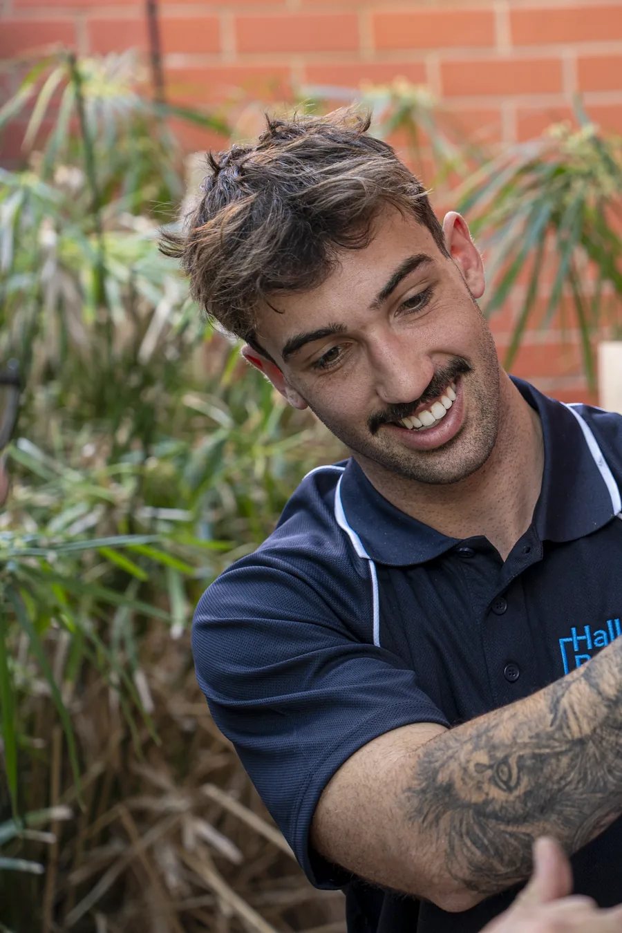 Hall & Baum plumber working on a home water filtration system