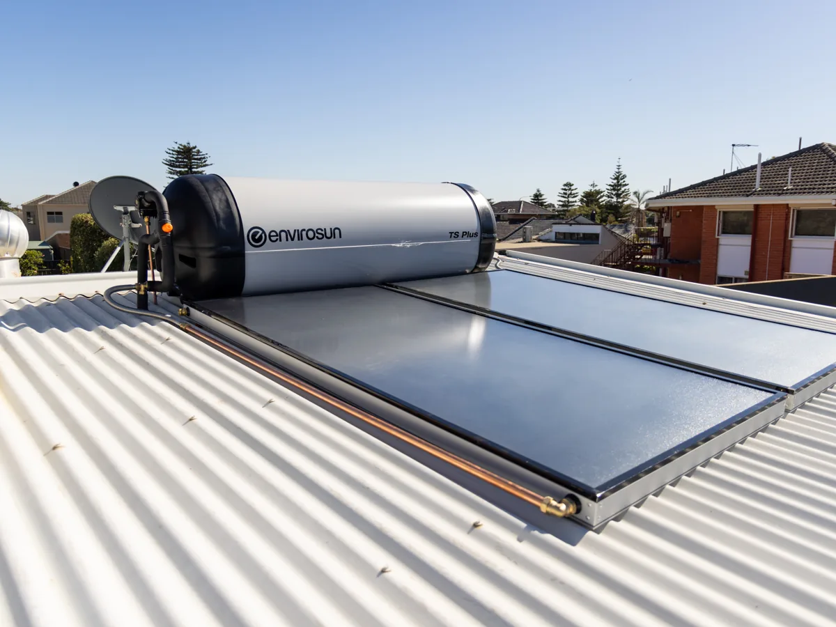 Solar hot water panels and storage tank on a home